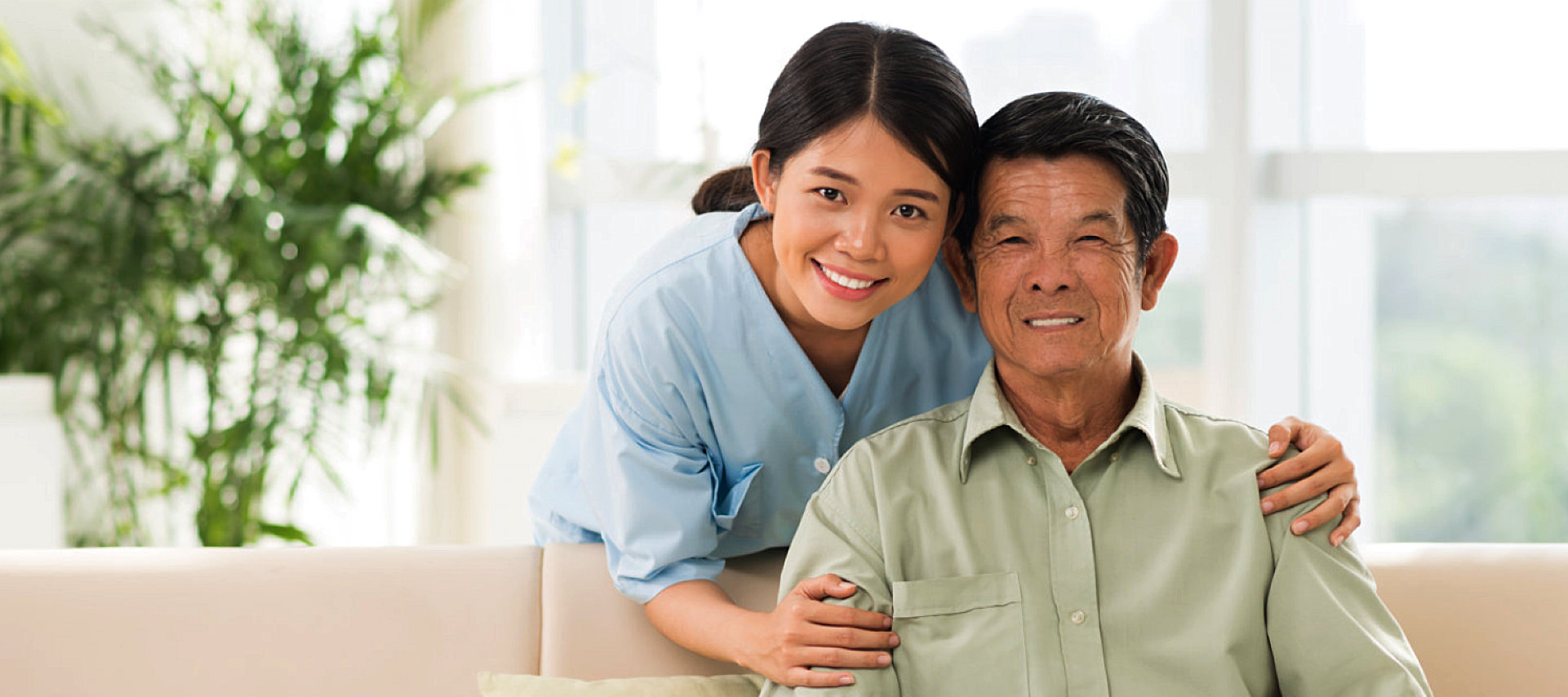 smiling caregiver and senior man