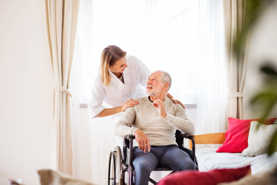 female caregiver and her old man patient