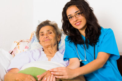 nurse caring for elderly patient