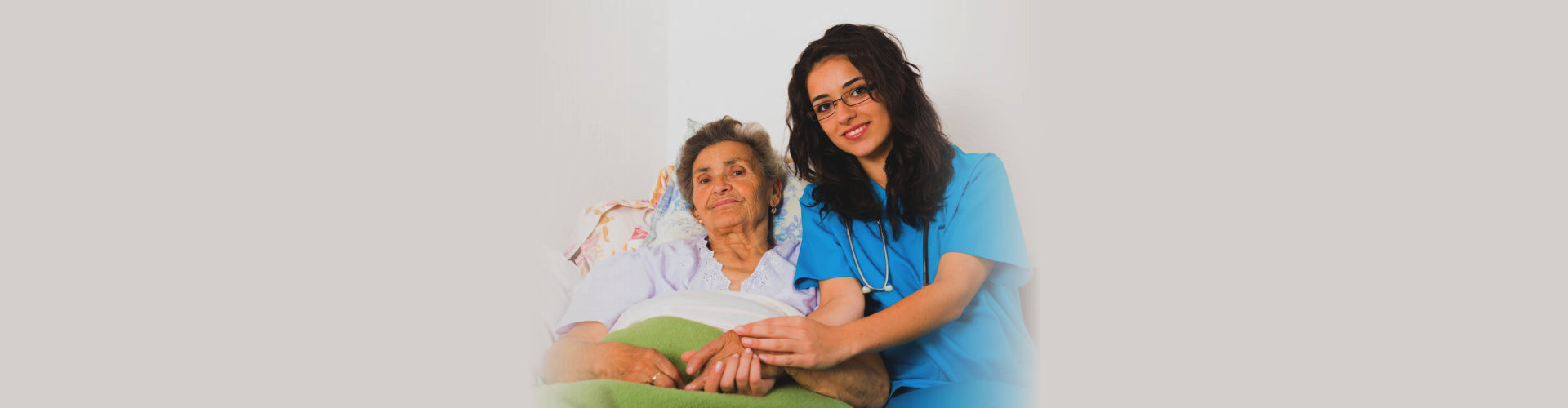 nurse caring for elderly patient
